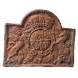 Carolean style cast iron fireback, bearing a coat of arms, 97cm wide, 77.5cm high