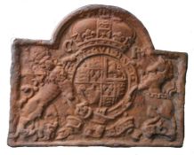 Carolean style cast iron fireback, bearing a coat of arms, 97cm wide, 77.5cm high