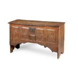 A rare Henry VIII oak boarded chest, circa 1540 The near one-piece lid with triple-moulded edge, the