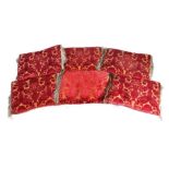 Six Renaissance style cushions Each with a crimson cisleé velvet on a 'gold' metallic ground,