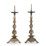 A pair of brass alloy, 'bell-metal', pricket candlesticks, Italian, circa 1590-1620 Each with a tall