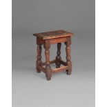 A James I oak joint stool, West Country, circa 1620 Having an ovolo-moulded top, rails with