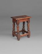 A James I oak joint stool, West Country, circa 1620 Having an ovolo-moulded top, rails with