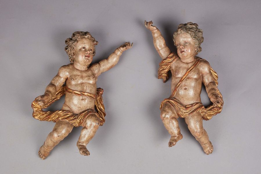 A pair of Baroque oak and original polychrome and gilt-decorated cherubs, Italian, circa 1660-80