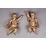 A pair of Baroque oak and original polychrome and gilt-decorated cherubs, Italian, circa 1660-80