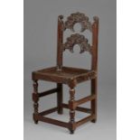 A rare Charles II oak backstool, Yorkshire/Lancashire, circa 1660 The back with two arched and