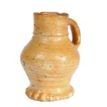 A small 15th century stoneware jug, Raeren, German, circa 1450 Honey glaze, with characteristic