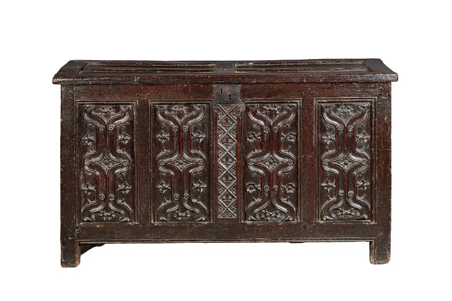 A fine and extremely rare Henry VIII oak parchemin-carved coffer, circa 1530 The hinged lid with