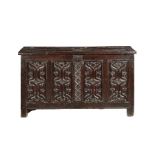 A fine and extremely rare Henry VIII oak parchemin-carved coffer, circa 1530 The hinged lid with