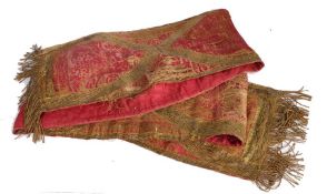 A long table runner of linen and silk crimson brocade, circa 1600 Applied with 'gold' lamellae