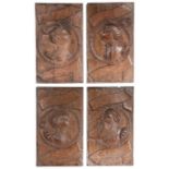 An interesting set of four Henry VIII oak Romayne-type family portrait panels, English, probably