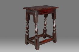 A William & Mary elm and oak joint stool, Welsh, circa 1690 Having a well-figured elm ovolo-