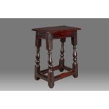 A William & Mary elm and oak joint stool, Welsh, circa 1690 Having a well-figured elm ovolo-