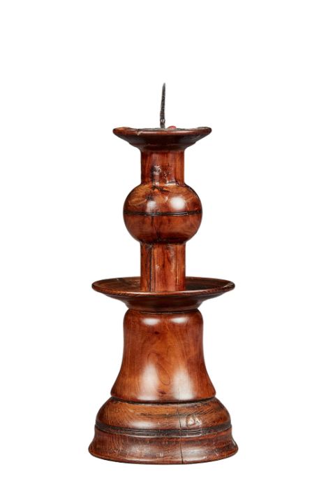 A rare yew bell-base and ball-knopped pricket candlestick Probably Elizabeth I, circa 1600 With