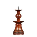 A rare yew bell-base and ball-knopped pricket candlestick Probably Elizabeth I, circa 1600 With