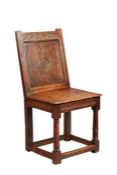 A rare Charles I joined oak closed-back side chair, Derbyshire, circa 1630, The back panel carved