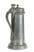 A large Charles I pewter flagon, circa 1630 Having a plain tapering drum with flared footrim, a