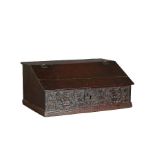 A Charles I oak boarded desk box, Yorkshire, circa 1640 The top and sloping lid with chip-carved