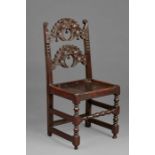 A Charles II oak backstool, Yorkshire, circa 1660-80 Having a typical back of two arched and cusp-