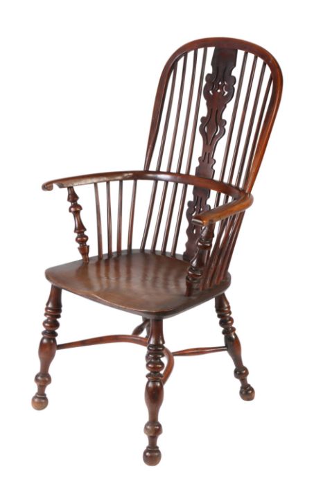 An impressive yew high-back Windsor armchair, Nottinghamshire, circa 1830-70 The hooped back with