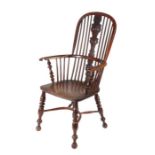 An impressive yew high-back Windsor armchair, Nottinghamshire, circa 1830-70 The hooped back with