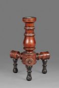 An unusual mid-19th century yew 'turner's' candlestick, English, circa 1850 Having a bulbous-