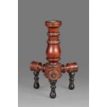 An unusual mid-19th century yew 'turner's' candlestick, English, circa 1850 Having a bulbous-