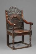 A rare Elizabeth I oak open armchair, Gloucestershire, circa 1580 The back panel with an applied