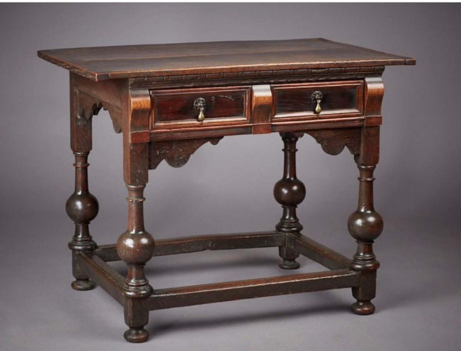 An unusual Charles II oak, elm and snakewood side table, East Anglia, circa 1660 Having a twin-