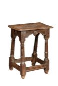 An extraordinarily rare Elizabeth I/James I oak joint stool, circa 1600-20 Having a six-pegged