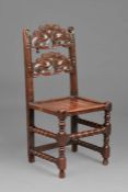 A Charles II oak backstool, Yorkshire, circa 1660 The back of two arched and cusp-profiled splats,