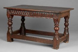 A fine Elizabeth I joined oak altar or serving table, circa 1590 Having a triple-boarded end-cleated