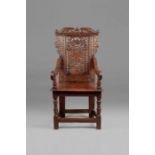 A good Charles I oak panel-back open armchair, in the Elizabethan manner, Derbyshire, circa 1640 The