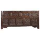 An impressive Charles II oak coffer front, in the Elizabethan manner, Lancashire, dated 1669 With