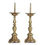 A pair of early 17th century brass pricket candlesticks, Italian/Dutch, circa 1600-20 Each with a