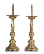 A pair of early 17th century brass pricket candlesticks, Italian/Dutch, circa 1600-20 Each with a