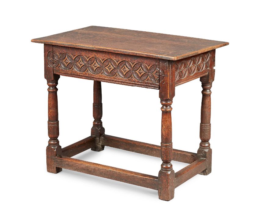 A small and rare Charles I oak side or centre table, Dorset, circa 1640 The boarded top with