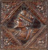 A good Henry VIII carved oak Romayne-type panel, circa 1540 Finely carved with a male portrait bust,