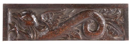 An Elizabeth I carved oak panel of a cockatrice, circa 1590-1600 Carved in high relief, with