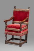 A rare Elizabeth I walnut and upholstered armchair, circa 1580 The rectangular back, squab-cushion