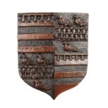 A small carved oak Coat of Arms, probably English, circa 1580-1630 Quartered, two with label and