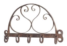An 18th century wrought-iron hanging rack, English Having a broad, flat bar with five pointed-