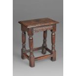 A Charles I oak joint stool, Somerset, circa 1630 Having a top with ovolo-moulded edge, pellet-