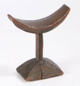 Tribal headrest, possibly Democratic Republic of Congo, having curved platform and base with incised