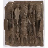 A Benin bronze figural plaque, depicting figures holding spears and clubs, 30.5cm wide, 36.5cm high