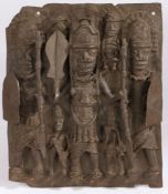 A Benin bronze figural plaque, depicting figures holding spears and clubs, 30.5cm wide, 36.5cm high