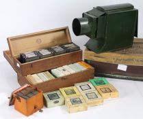 Butchers "Boys Own" magic lantern, housed in original box, together with three boxes of slides to