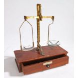 A 19th Century set of boxed brass scales, made by De Grave Short & Co, London, the teak case with