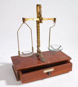 A 19th Century set of boxed brass scales, made by De Grave Short & Co, London, the teak case with