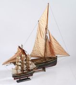 Painted wooden model sailing barge, with maroon and black painted hull, with two masts, 59cm long,